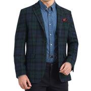 A man wearing a black watch tartan kilt jacket with vest, featuring brown, green, and blue check patterns, fastened with black and gold buttons.