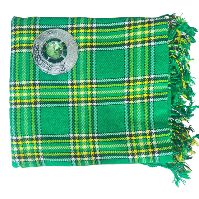 Green plaid fabric with a central emblem on a white background