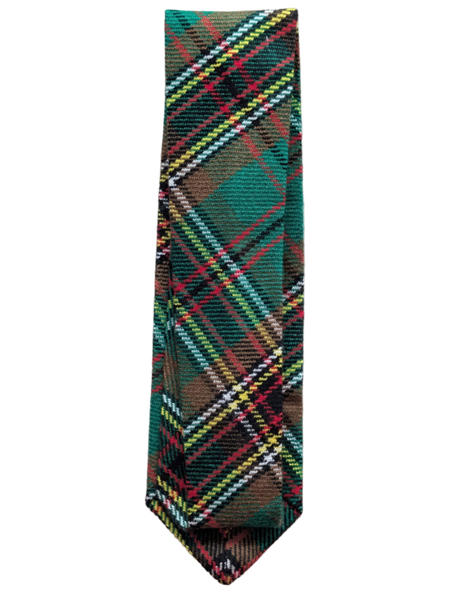 Plaid tie with green, red, and brown colors on a light gray background