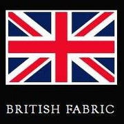 A square graphic showing the Union Jack flag above the words 'BRITISH FABRIC' in white serif text on a black background.