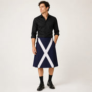 Man wearing a black shirt and navy kilt with a white cross on a white background