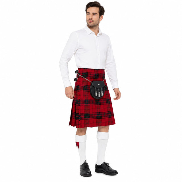 Man wearing a Maxwell Modern Clan Tartan Kilt plaid kilt with a white shirt and black shoes on a white background