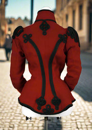 Red coat with black trim on a mannequin against a white background