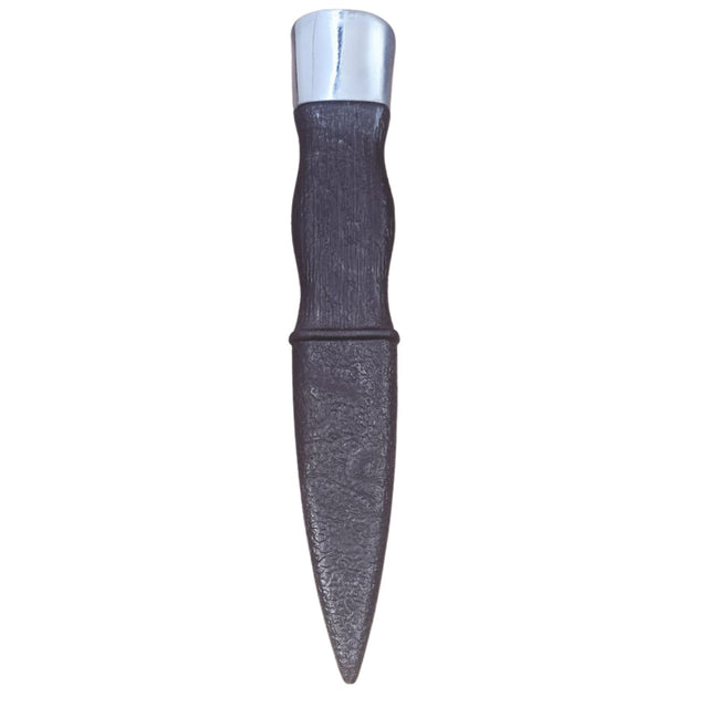 Decorative dagger with a silver top and textured black handle on a white background