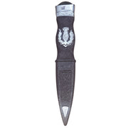 Decorative dagger with intricate designs on a white background