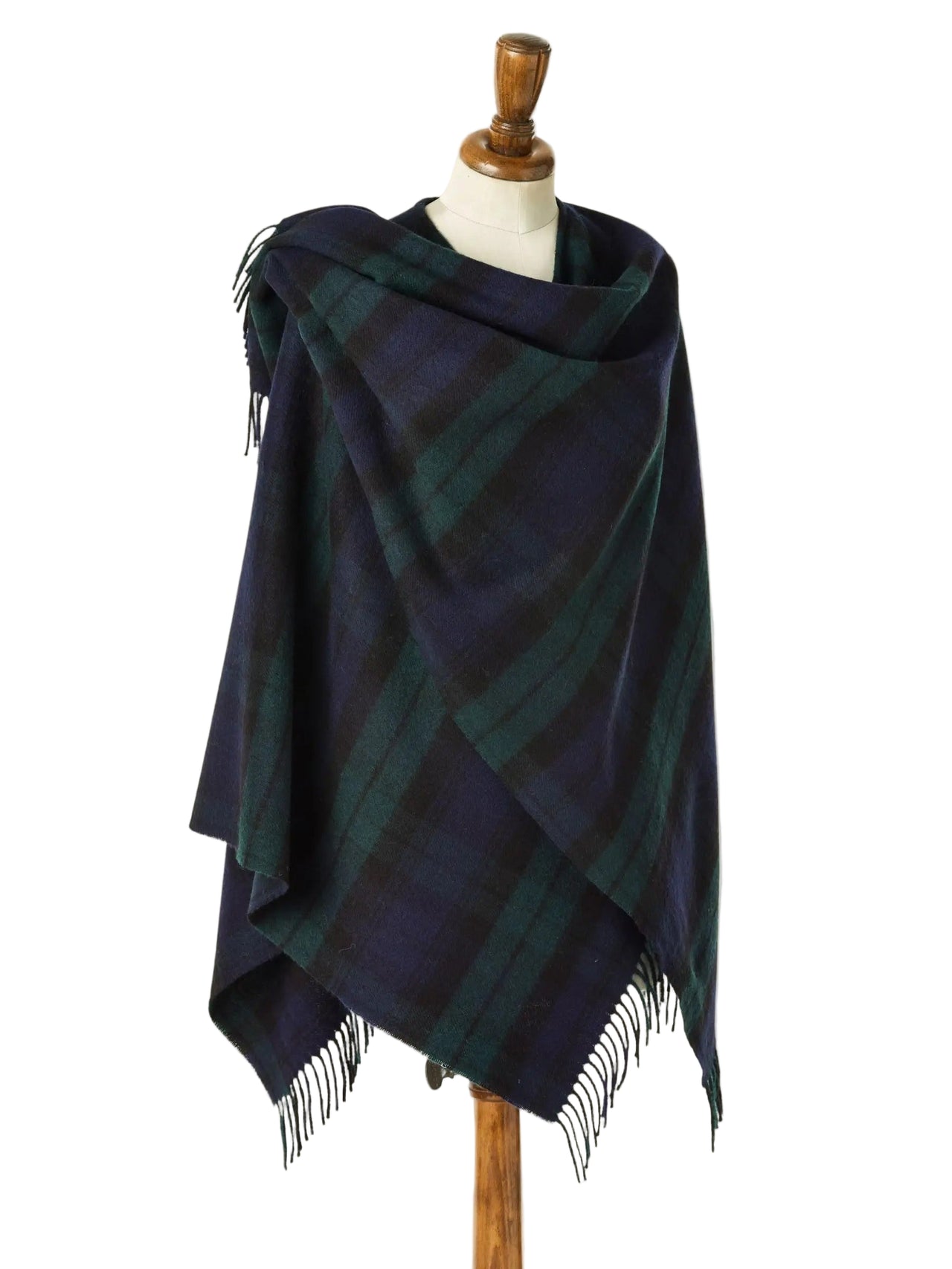 Navy and green plaid shawl on a mannequin against a beige background