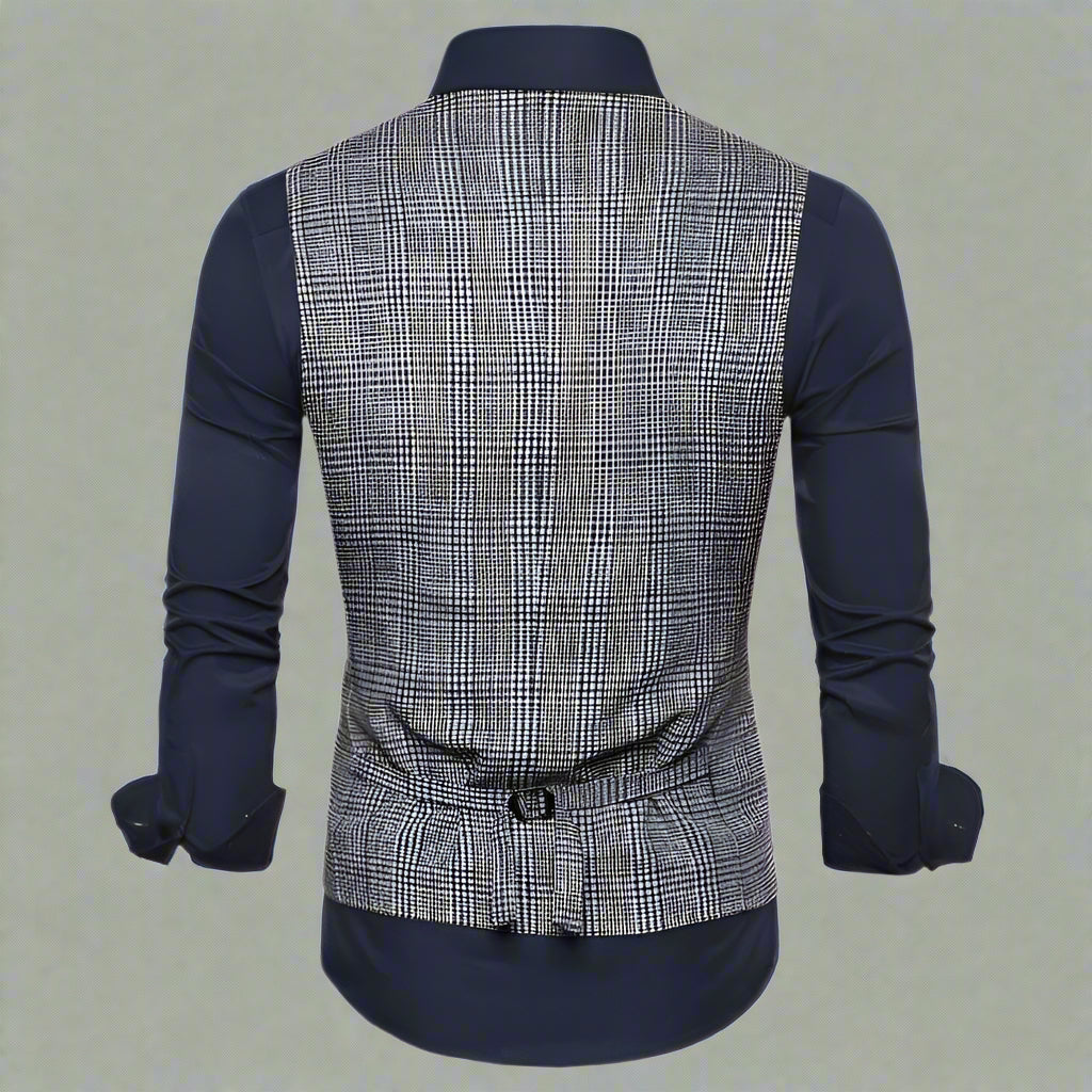 Back view of a plaid vest over a navy shirt on a white background